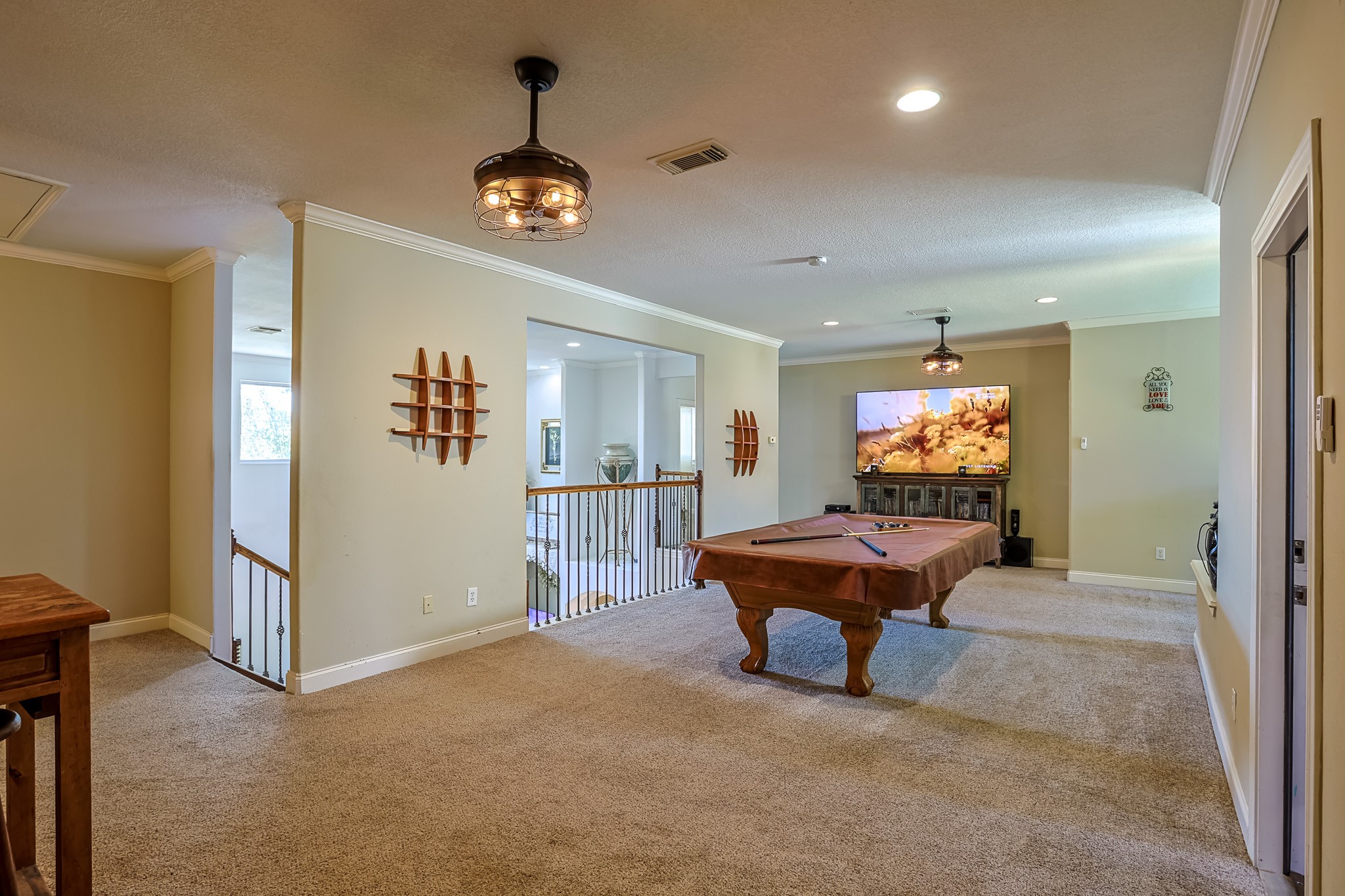 30119 West Geneva Drive Spring, TX 77386 - Photo 20 of 35 Expansive upstairs game room perfect for entertaining, featuring plush carpeting, designer lighting, and open views to the main living area below