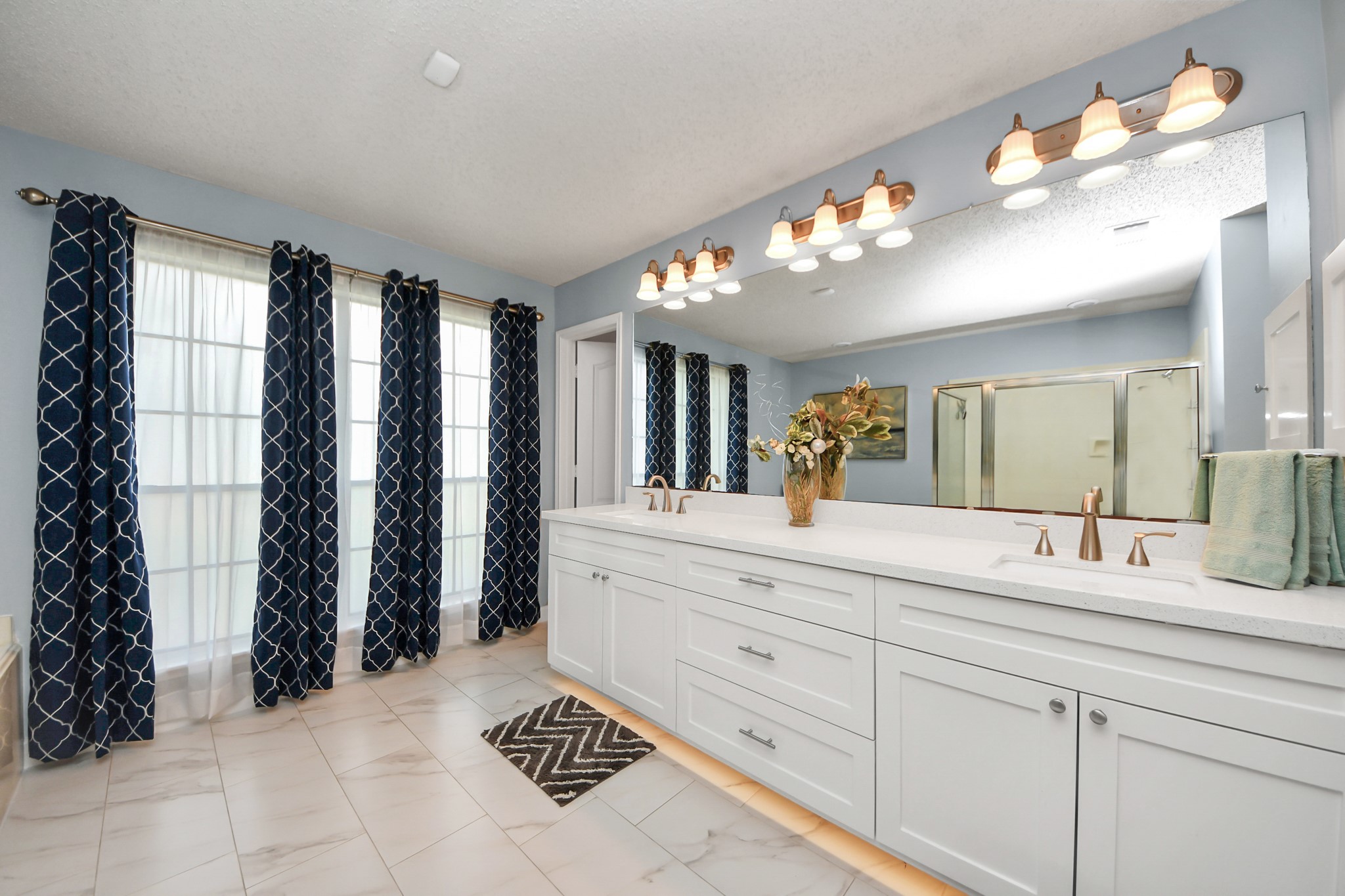 3107 Dulaney Road Houston, TX 77084 - Photo 20 of 50 a bathroom with a sink a vanity and a mirror