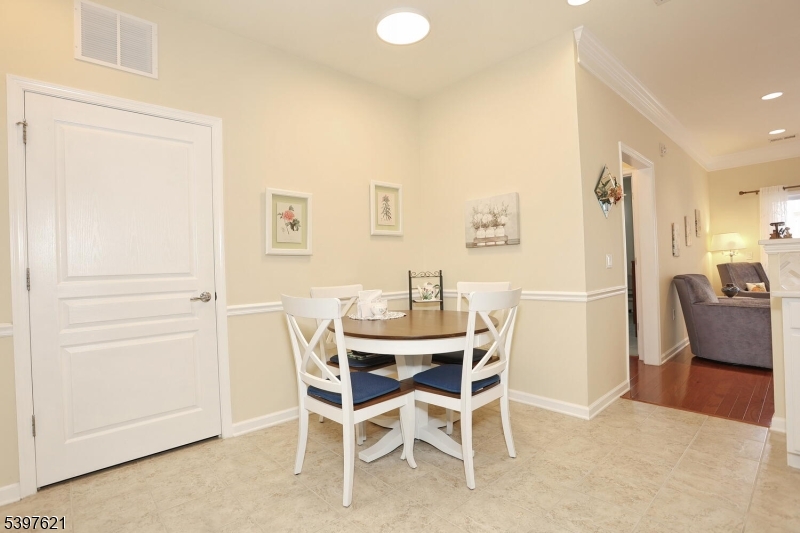 3214 Warren's Way Wanaque, NJ 07465 - Photo 16 of 42 a view of a dining room with furniture and a chandelier