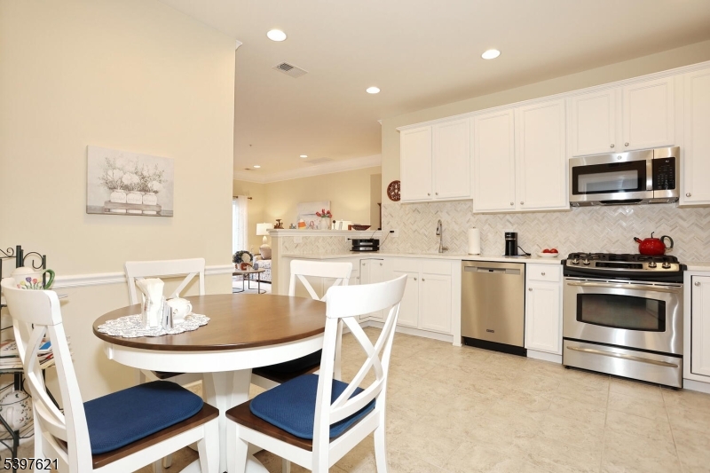 3214 Warren's Way Wanaque, NJ 07465 - Photo 17 of 42 a kitchen with a sink cabinets and stainless steel appliances