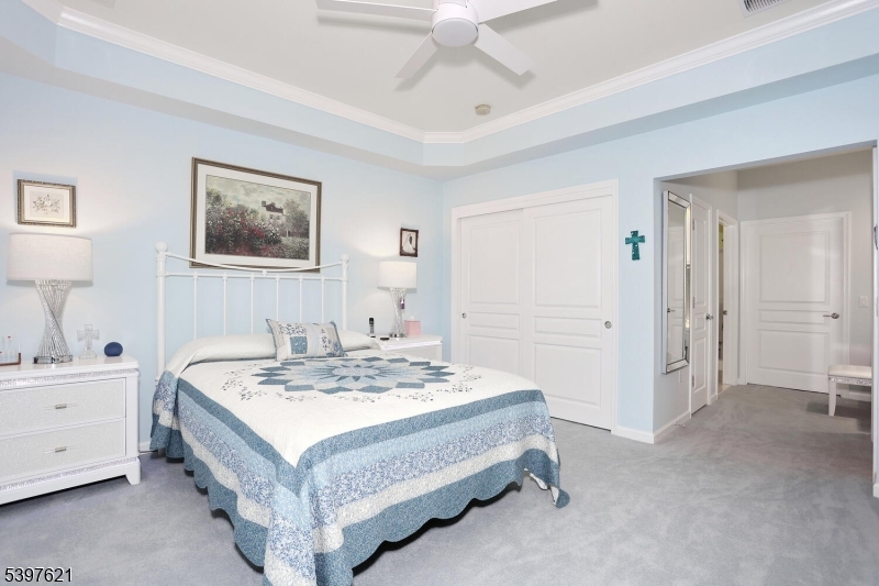 3214 Warren's Way Wanaque, NJ 07465 - Photo 20 of 42 a spacious bedroom with a bed and a table in it