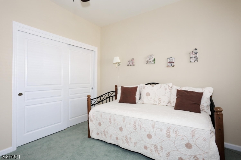 3214 Warren's Way Wanaque, NJ 07465 - Photo 24 of 42 a bedroom with a bed and a night stand