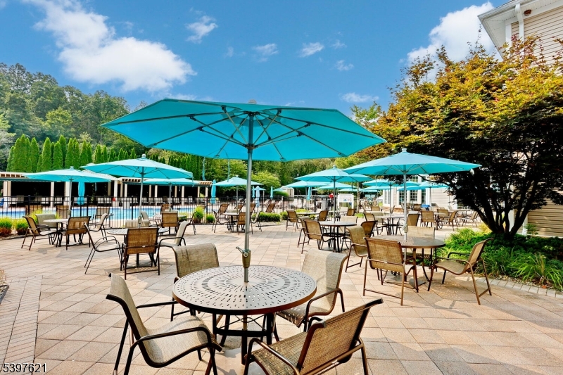 3214 Warren's Way Wanaque, NJ 07465 - Photo 38 of 42 a patio with a table and chairs under an umbrella