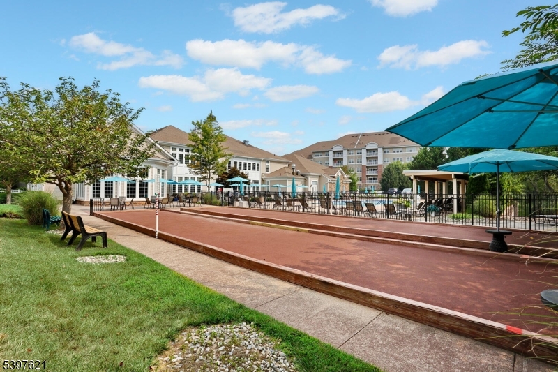 3214 Warren's Way Wanaque, NJ 07465 - Photo 40 of 42 a view of a street with a table and chairs under an umbrella