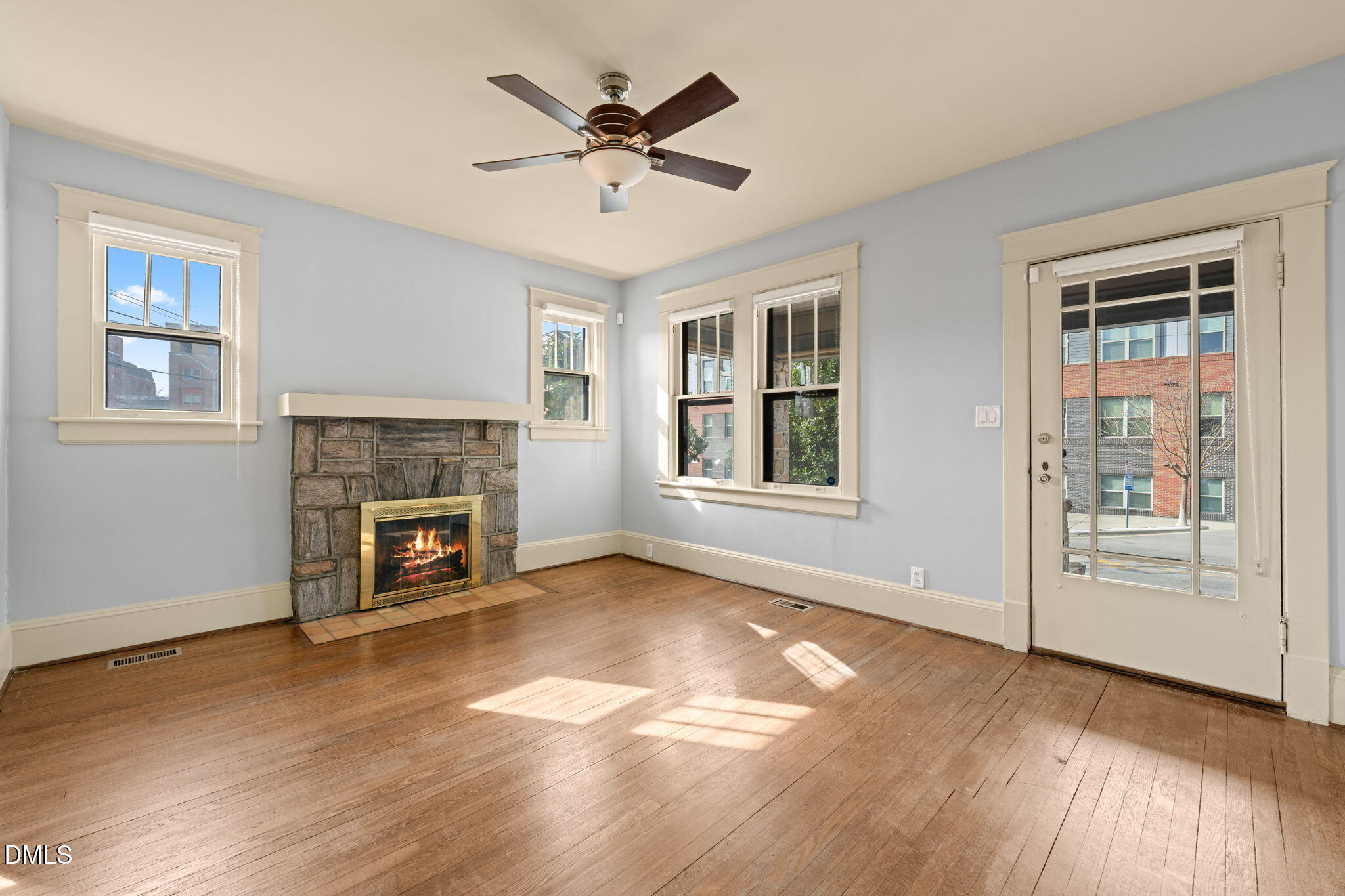 4 Dixie Trail Raleigh, NC 27607 - Photo 10 of 23 an empty room with windows and fireplace
