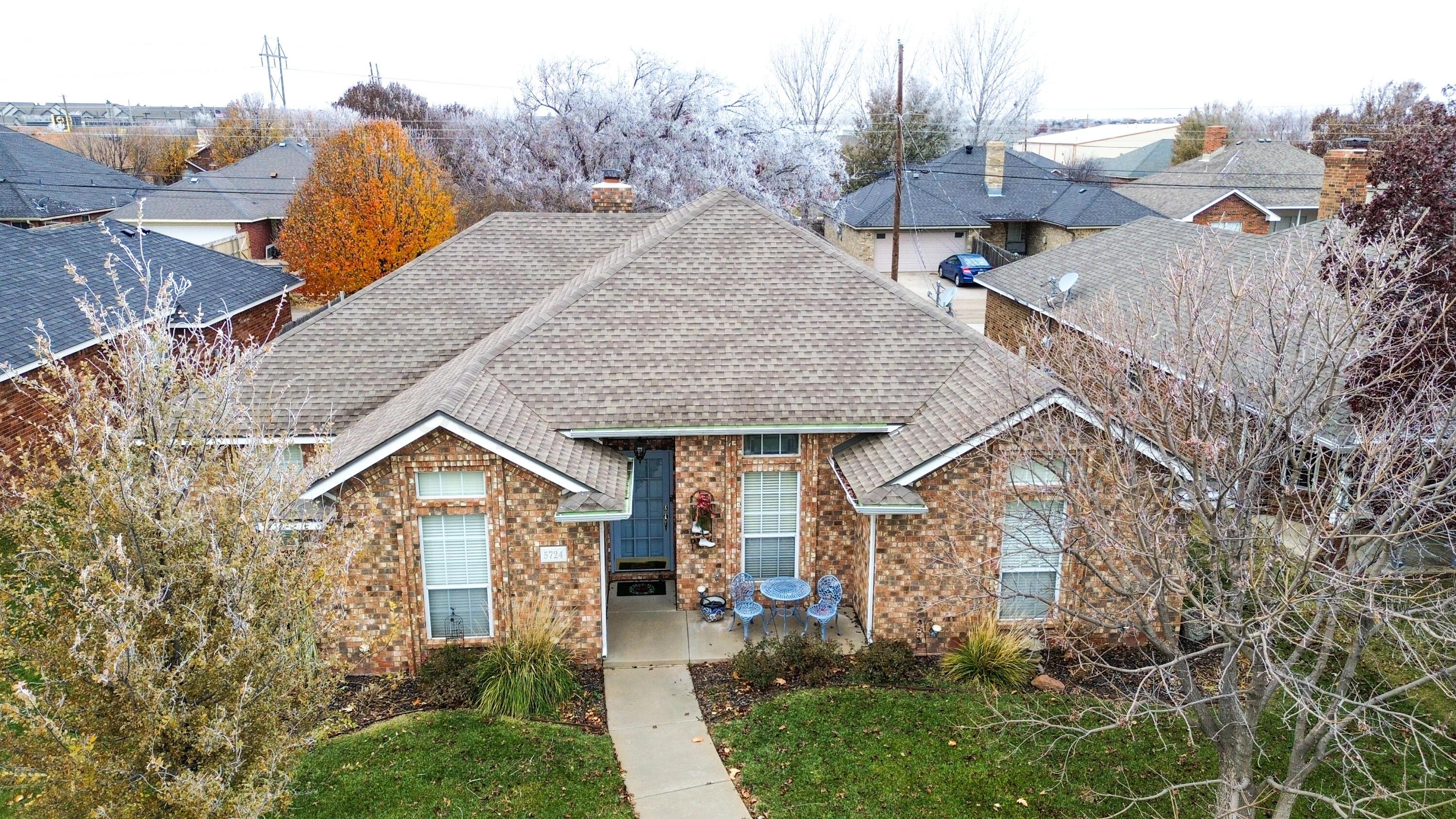 5724 Spencer Street Amarillo, TX 79109 - Photo 1 of 37 a view of multiple houses with a yard and stairs