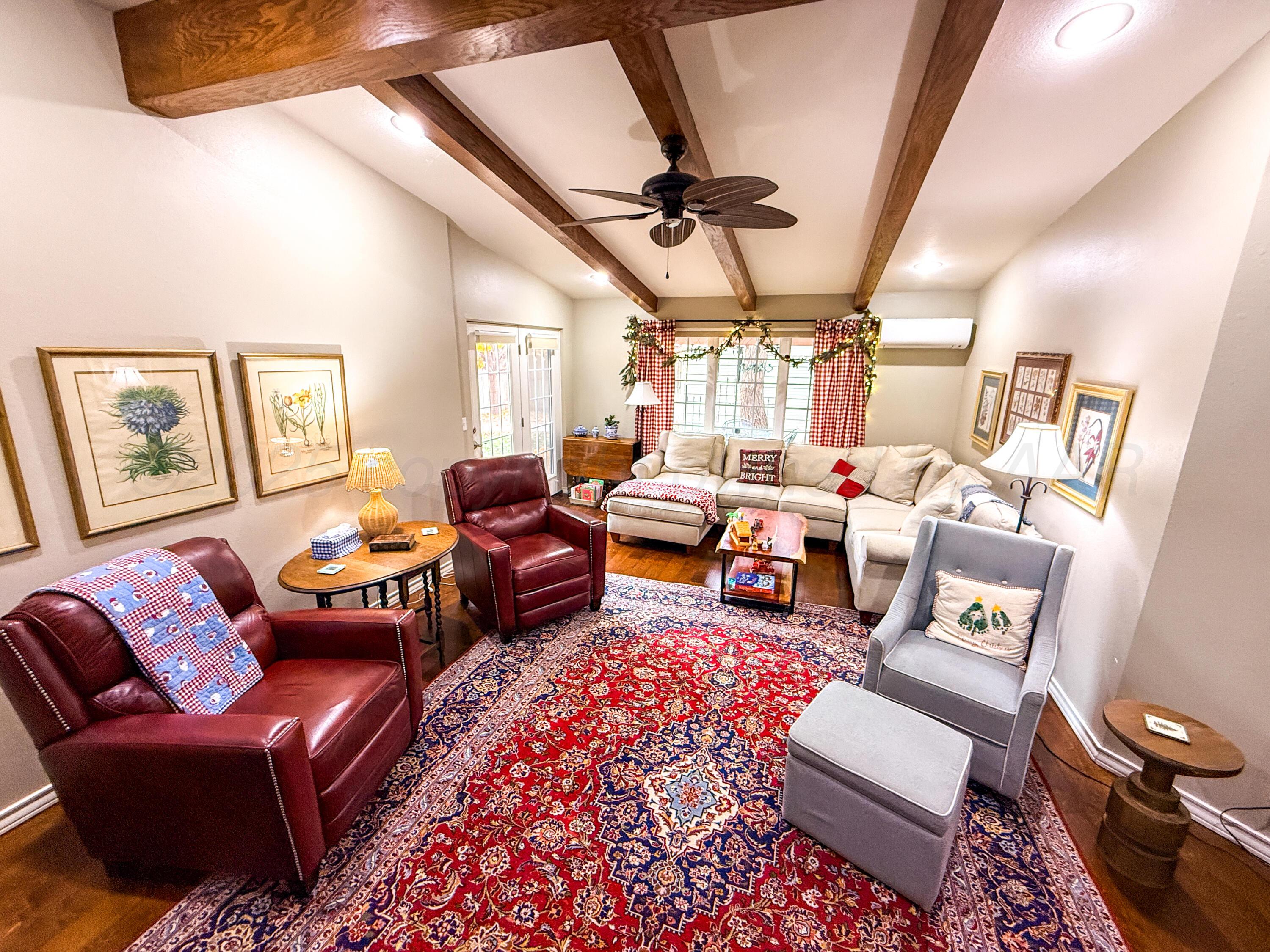 5724 Spencer Street Amarillo, TX 79109 - Photo 31 of 37 a living room with furniture a rug and a window