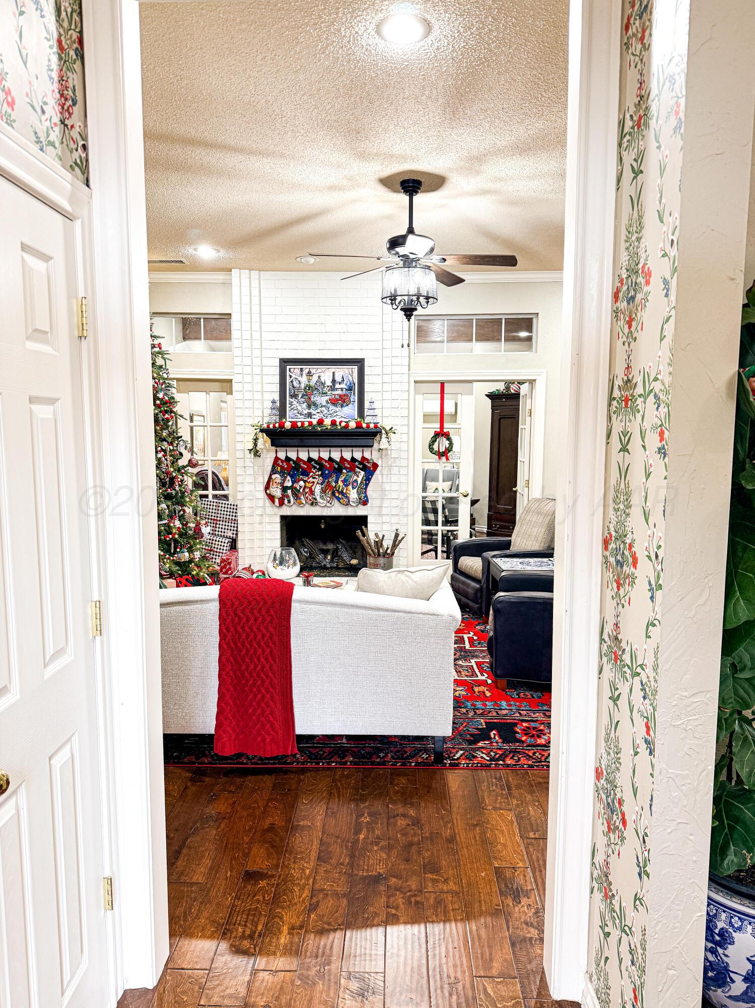 5724 Spencer Street Amarillo, TX 79109 - Photo 5 of 37 a living room with furniture and a fireplace