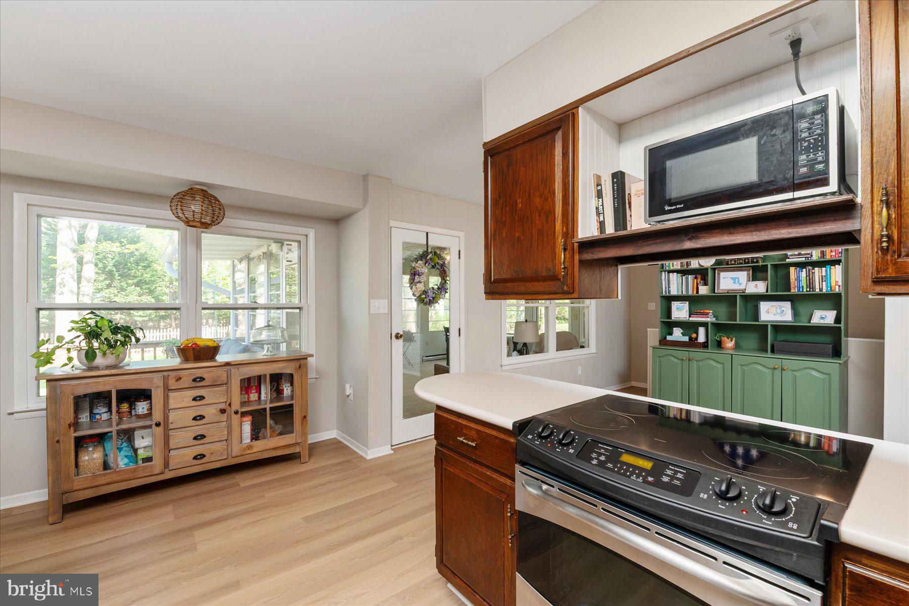 86 Milburn Circle Pasadena, MD 21122 - Photo 16 of 60 a open kitchen with stainless steel appliances granite countertop a stove and a microwave