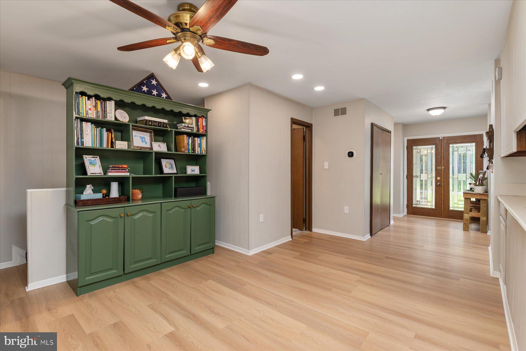 86 Milburn Circle Pasadena, MD 21122 - Photo 17 of 60 a view of a livingroom with a bookshelf