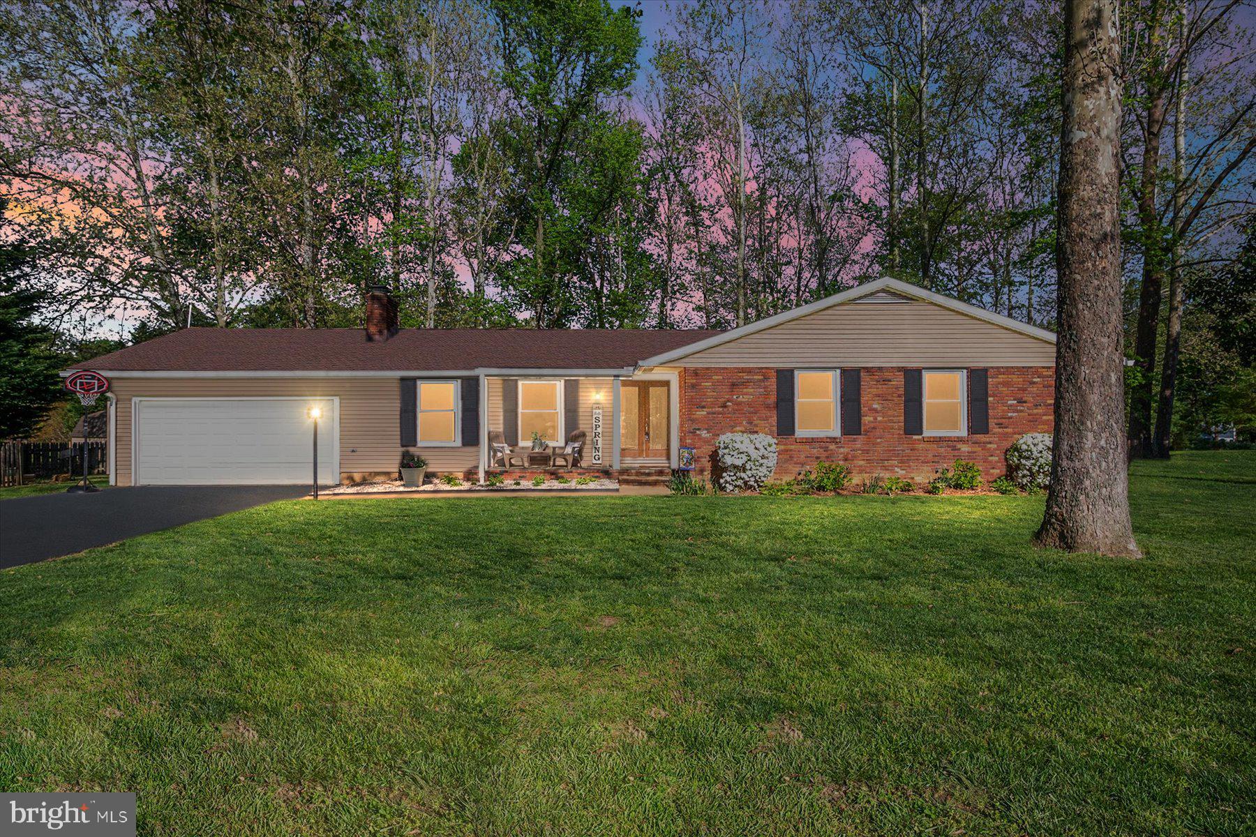 86 Milburn Circle Pasadena, MD 21122 - Photo 2 of 60 a front view of a house with yard and green space