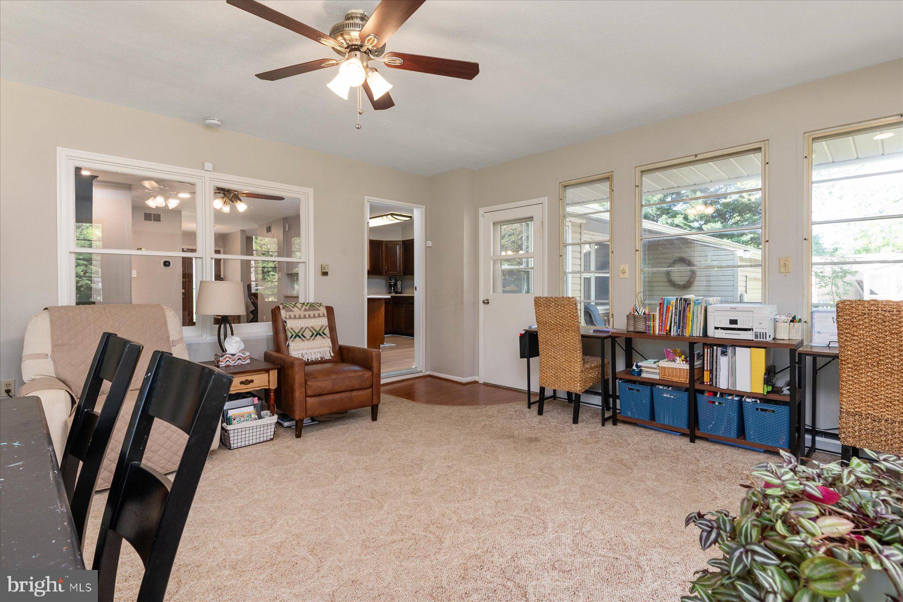 86 Milburn Circle Pasadena, MD 21122 - Photo 21 of 60 a living room with furniture and a flat screen tv