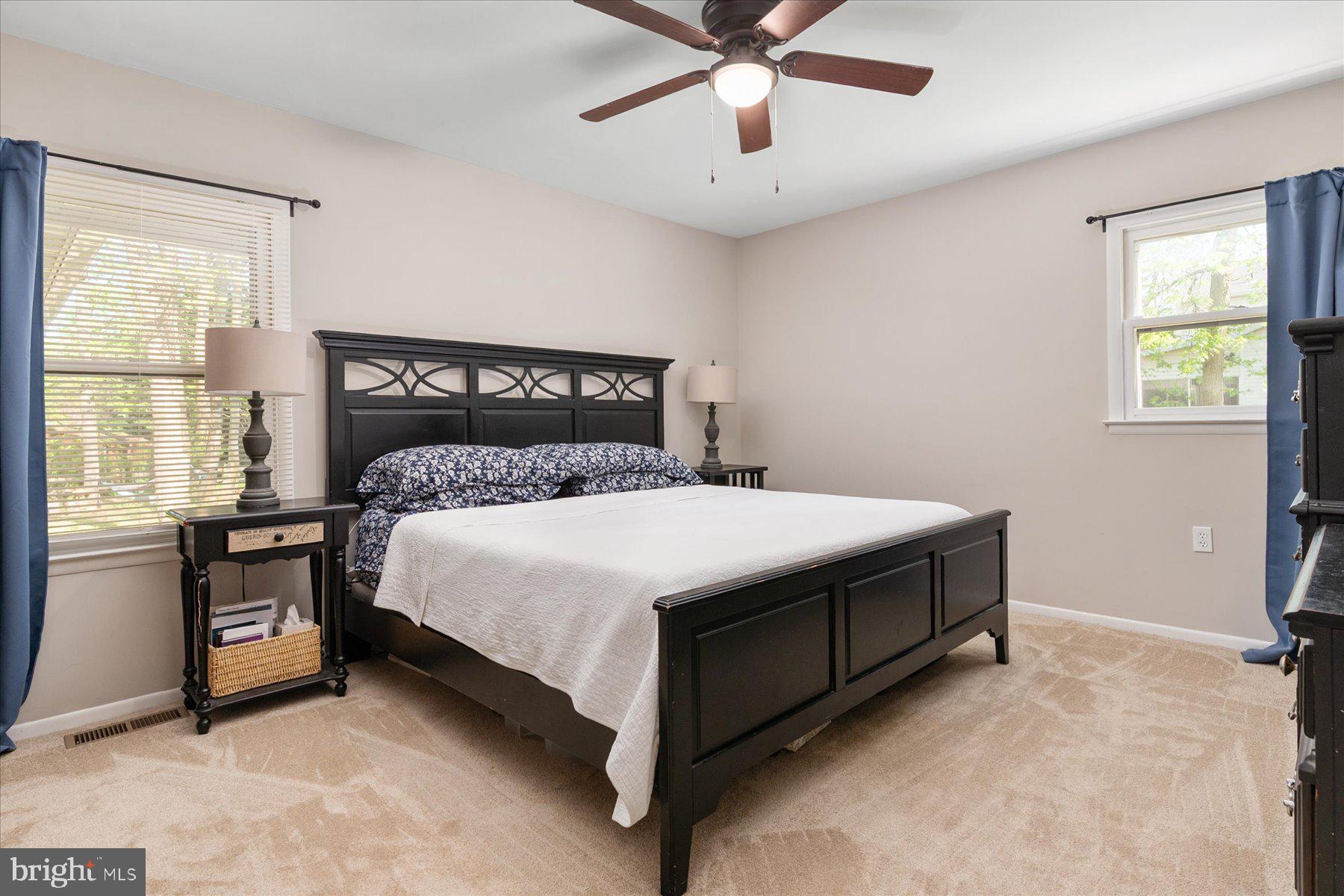 86 Milburn Circle Pasadena, MD 21122 - Photo 27 of 60 a bed sitting in a bedroom next to a window