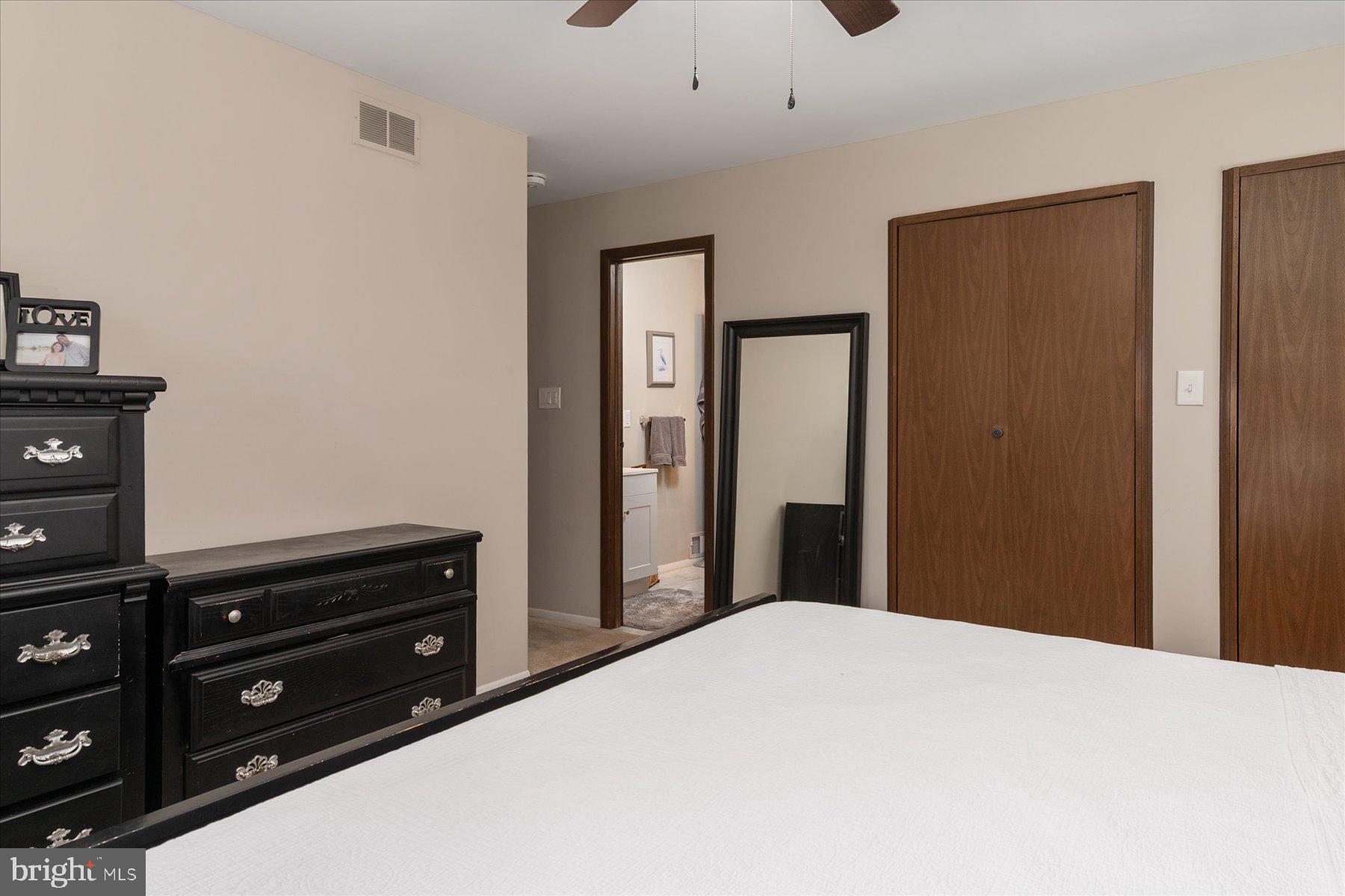 86 Milburn Circle Pasadena, MD 21122 - Photo 29 of 60 a bedroom with a bed and a dresser