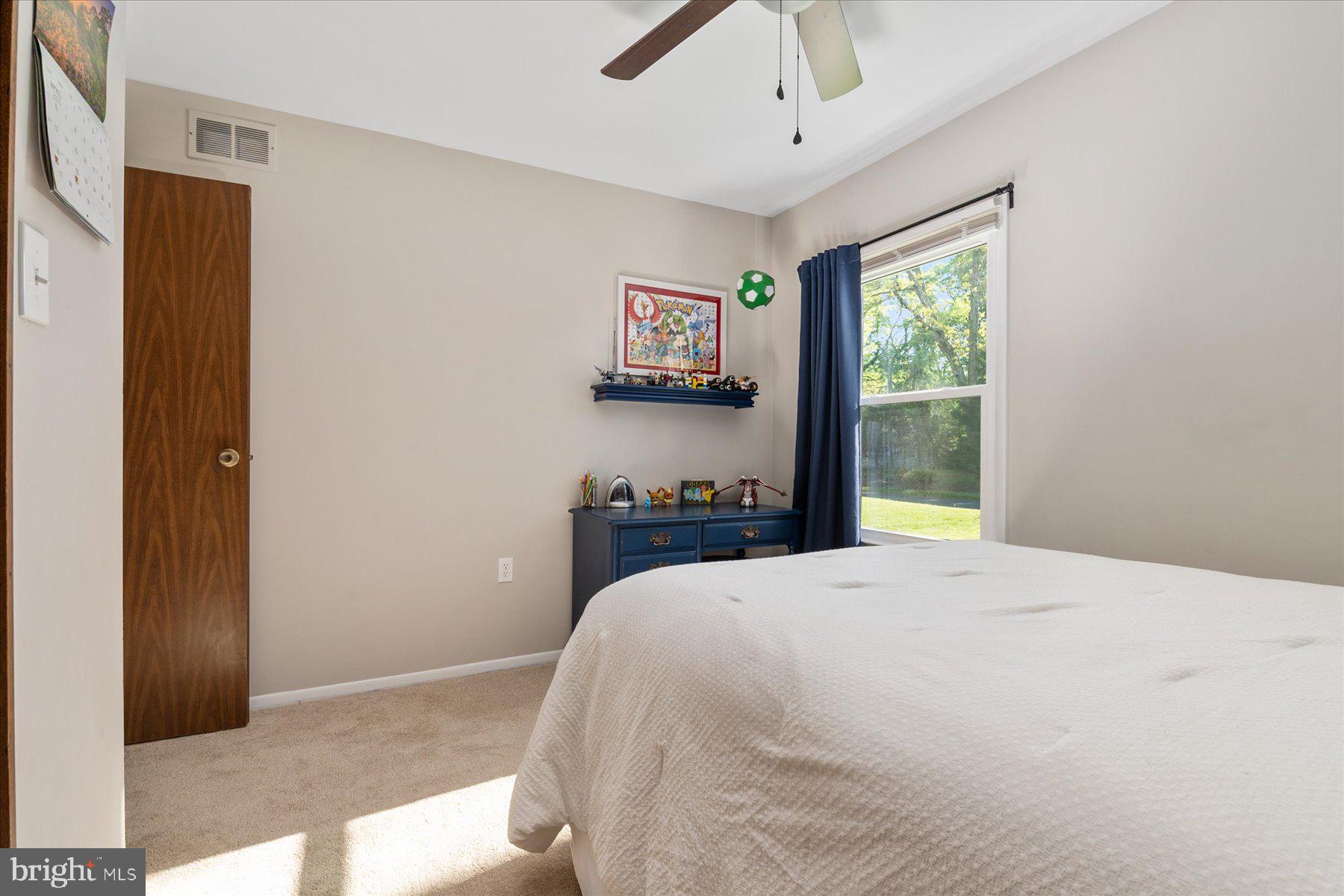 86 Milburn Circle Pasadena, MD 21122 - Photo 36 of 60 a spacious bedroom with a bed and a window