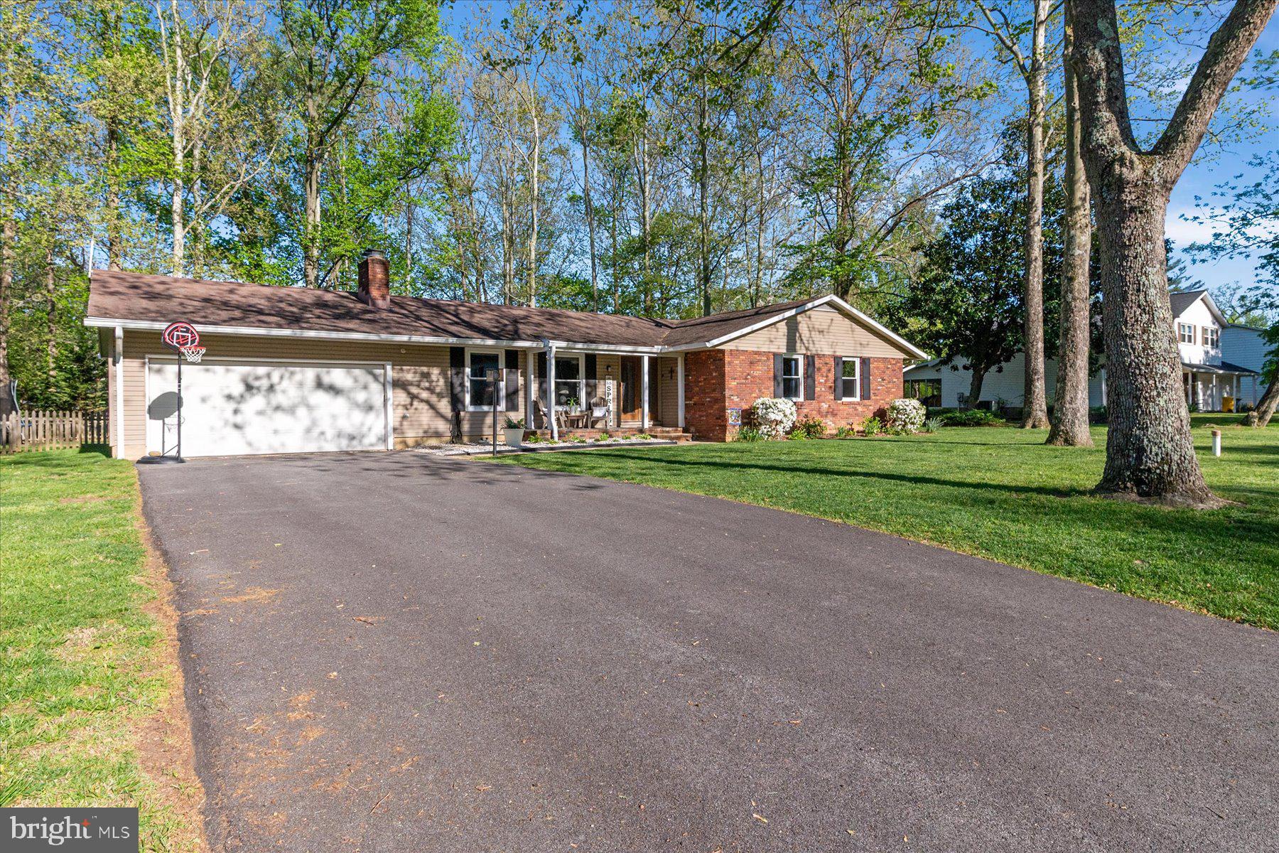 86 Milburn Circle Pasadena, MD 21122 - Photo 4 of 60 a front view of house with yard and green space
