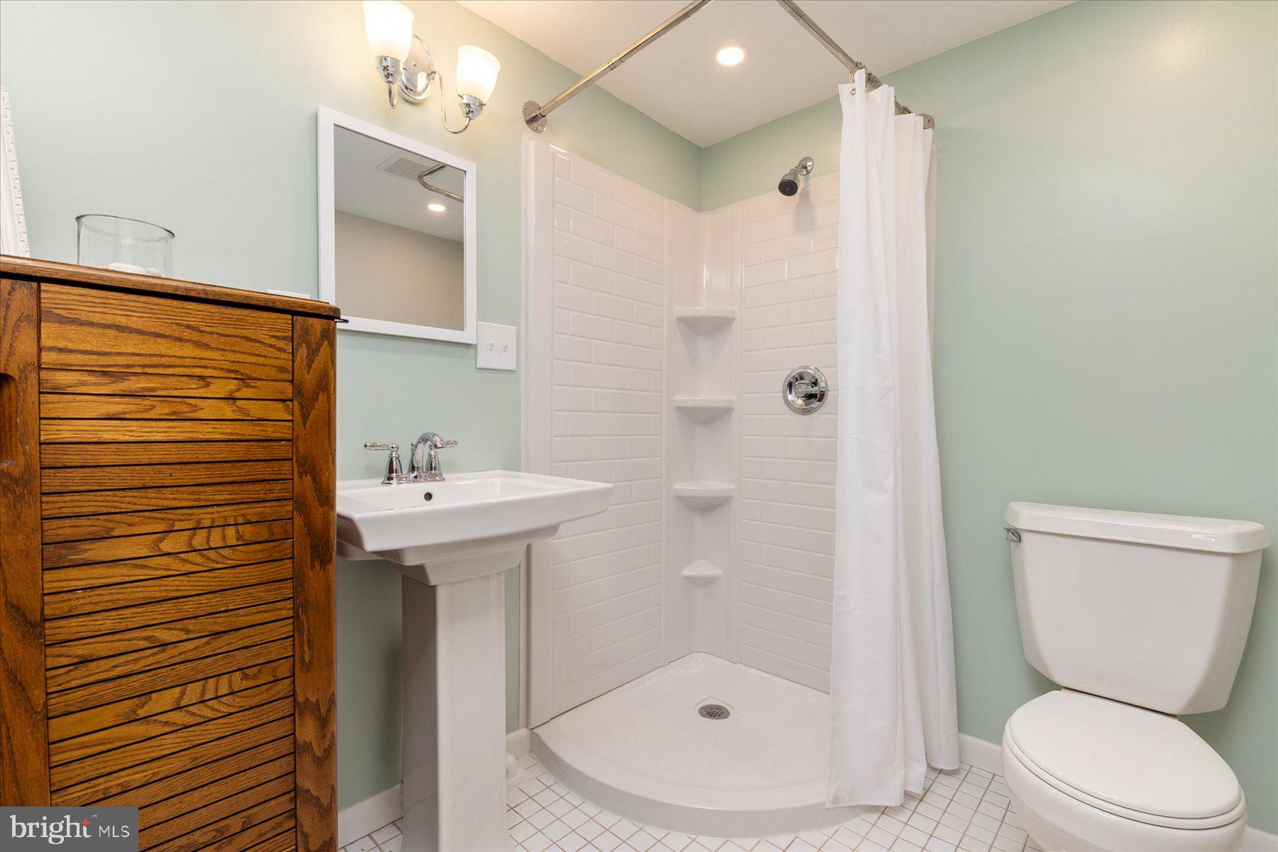 86 Milburn Circle Pasadena, MD 21122 - Photo 45 of 60 a bathroom with a sink toilet and shower