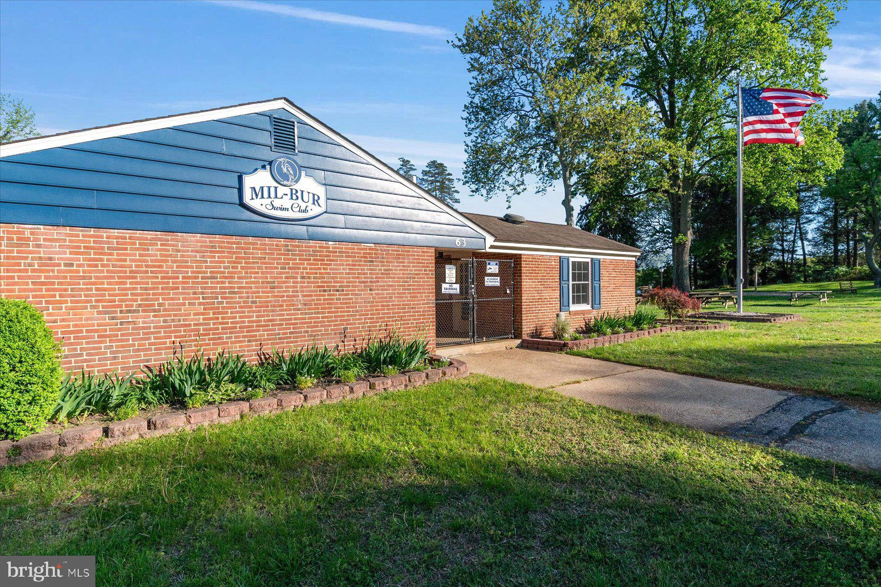 86 Milburn Circle Pasadena, MD 21122 - Photo 54 of 60 a front view of a house with a yard and garage