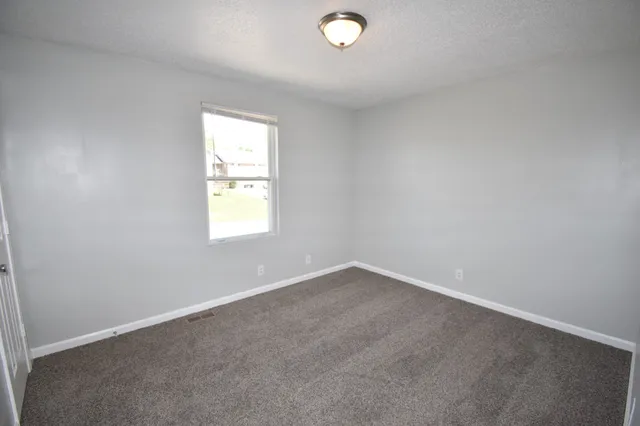 an empty room with window