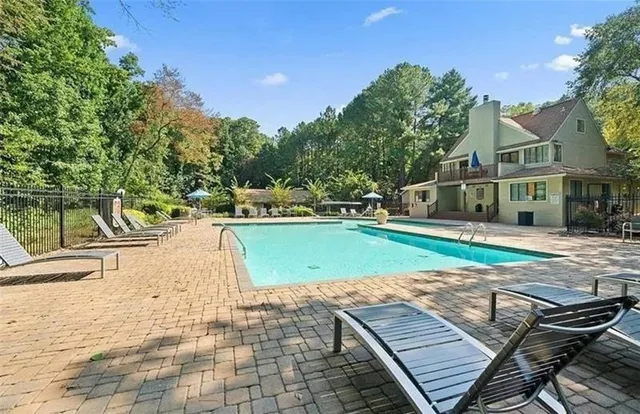 a view of a swimming pool with a patio