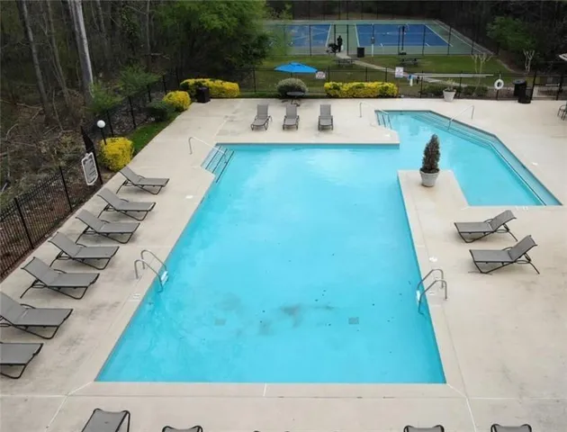 swimming pool with outdoor seating