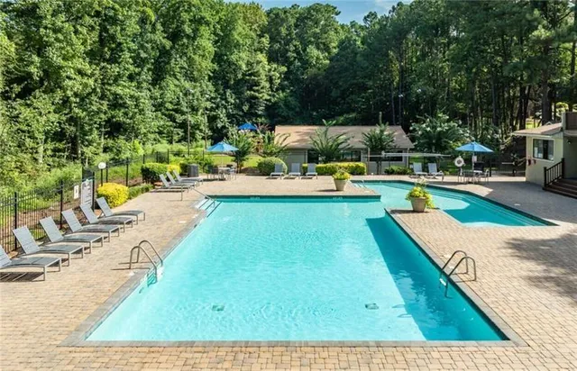 a room with gym equipment and large window