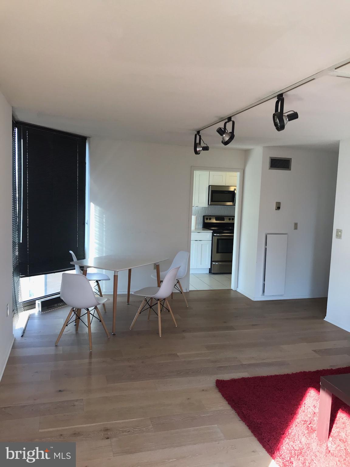 2020 Walnut Street, Unit 21E Philadelphia, PA 19103 - Photo 4 of 19 a view of a dining room with furniture