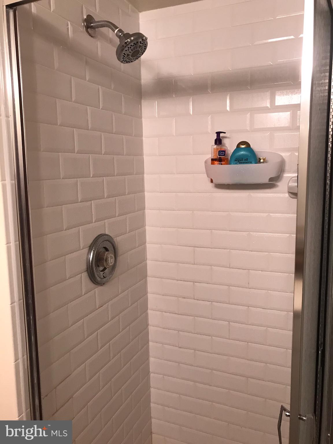 2020 Walnut Street, Unit 21E Philadelphia, PA 19103 - Photo 9 of 19 a bathroom with a shower