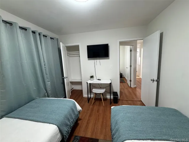 a bedroom with a bed and a table in it