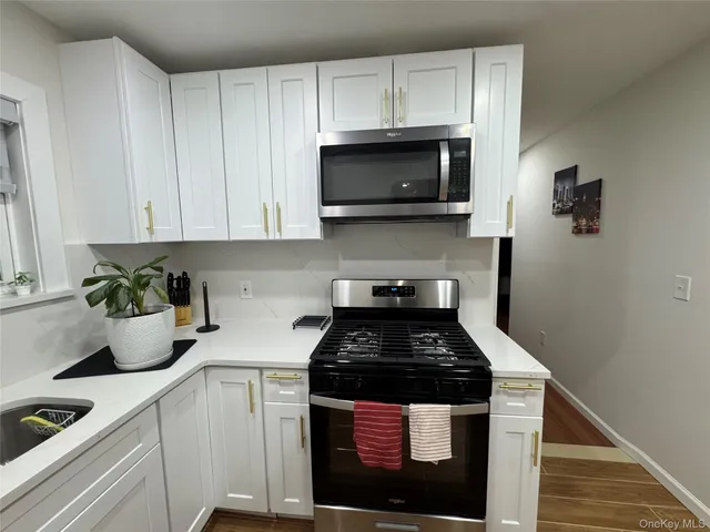 a kitchen with a stove and cabinets
