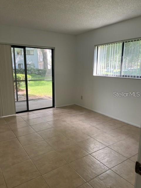 3300 Fox Chase Circle, Unit 226 Palm Harbor, FL 34683 - Photo 6 of 13 a view of an empty room with a window