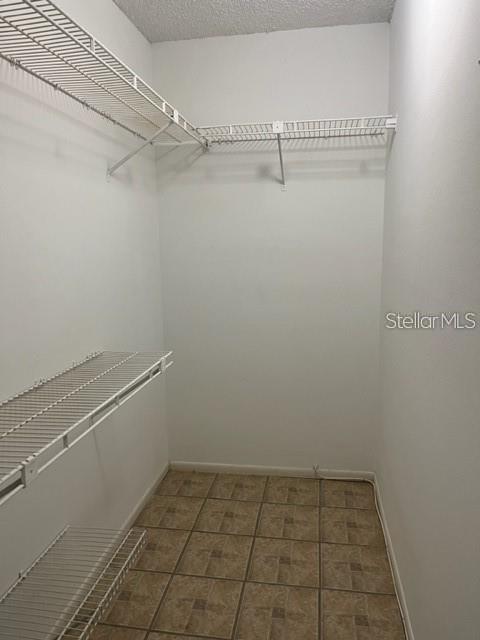 3300 Fox Chase Circle, Unit 226 Palm Harbor, FL 34683 - Photo 7 of 13 a view of a room with racks on the wall