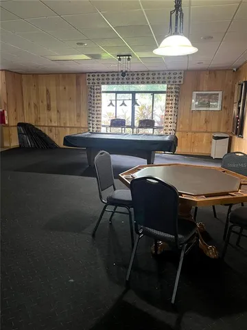 a view of a dining room with furniture and window