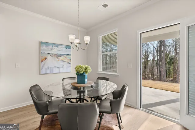 a bathroom with a granite countertop sink a toilet a mirror a bathtub and shower