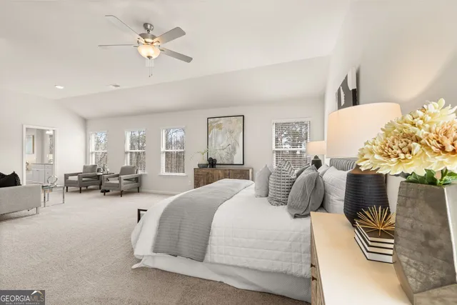 a white bath tub sitting next to a shower