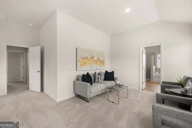 a view of a hallway with a bathroom