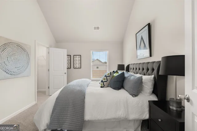 a bathroom with a granite countertop sink a large mirror and a shower