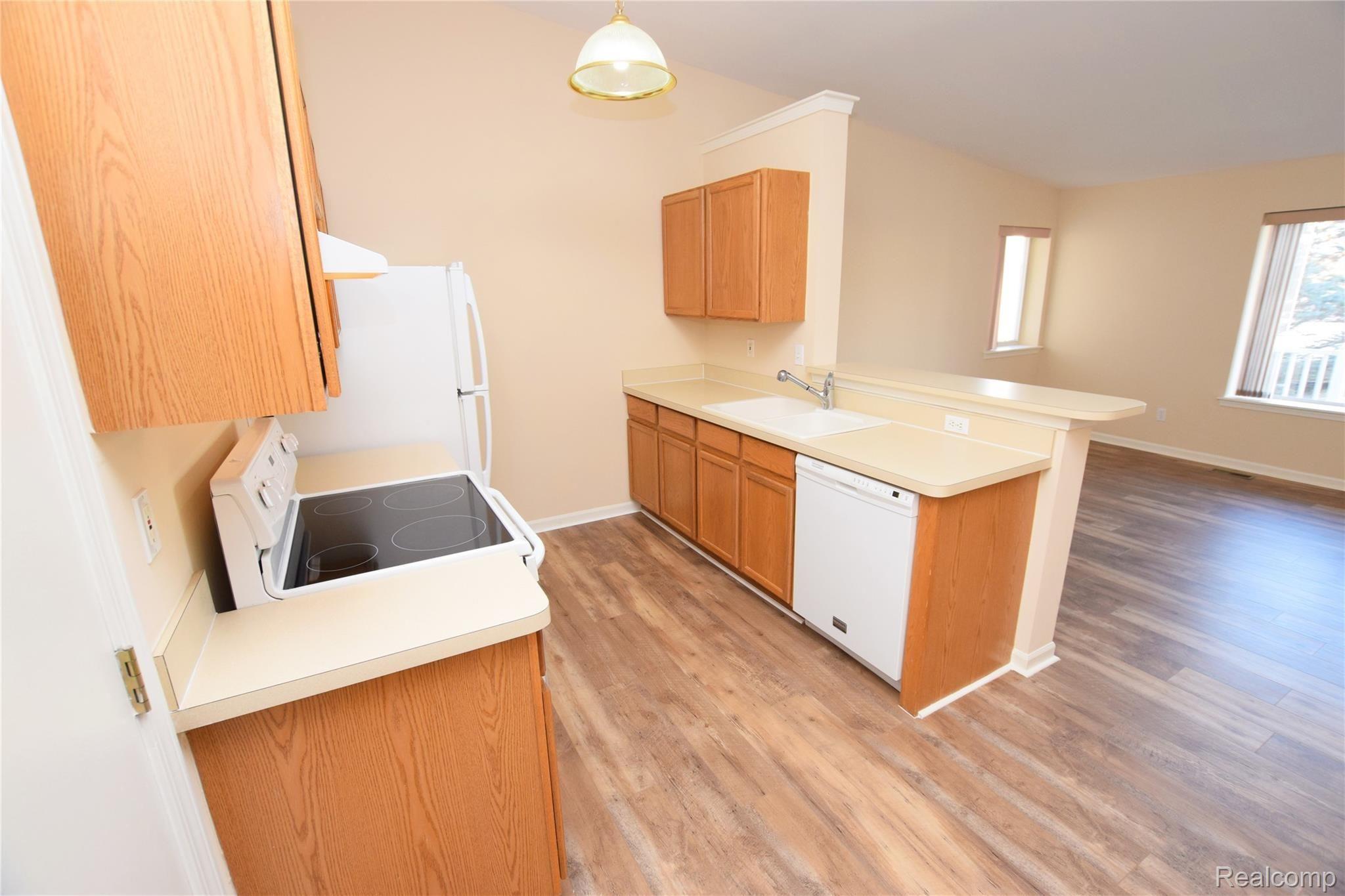 9524 Timber Ridge Drive Grand Blanc, MI 48439 - Photo 7 of 17 Kitchen with New Wood Floors