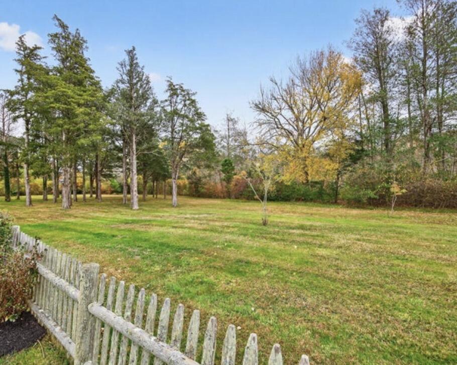 25 Whig Street Dennis, MA 02638 - Photo 5 of 8 a yard with trees in the background