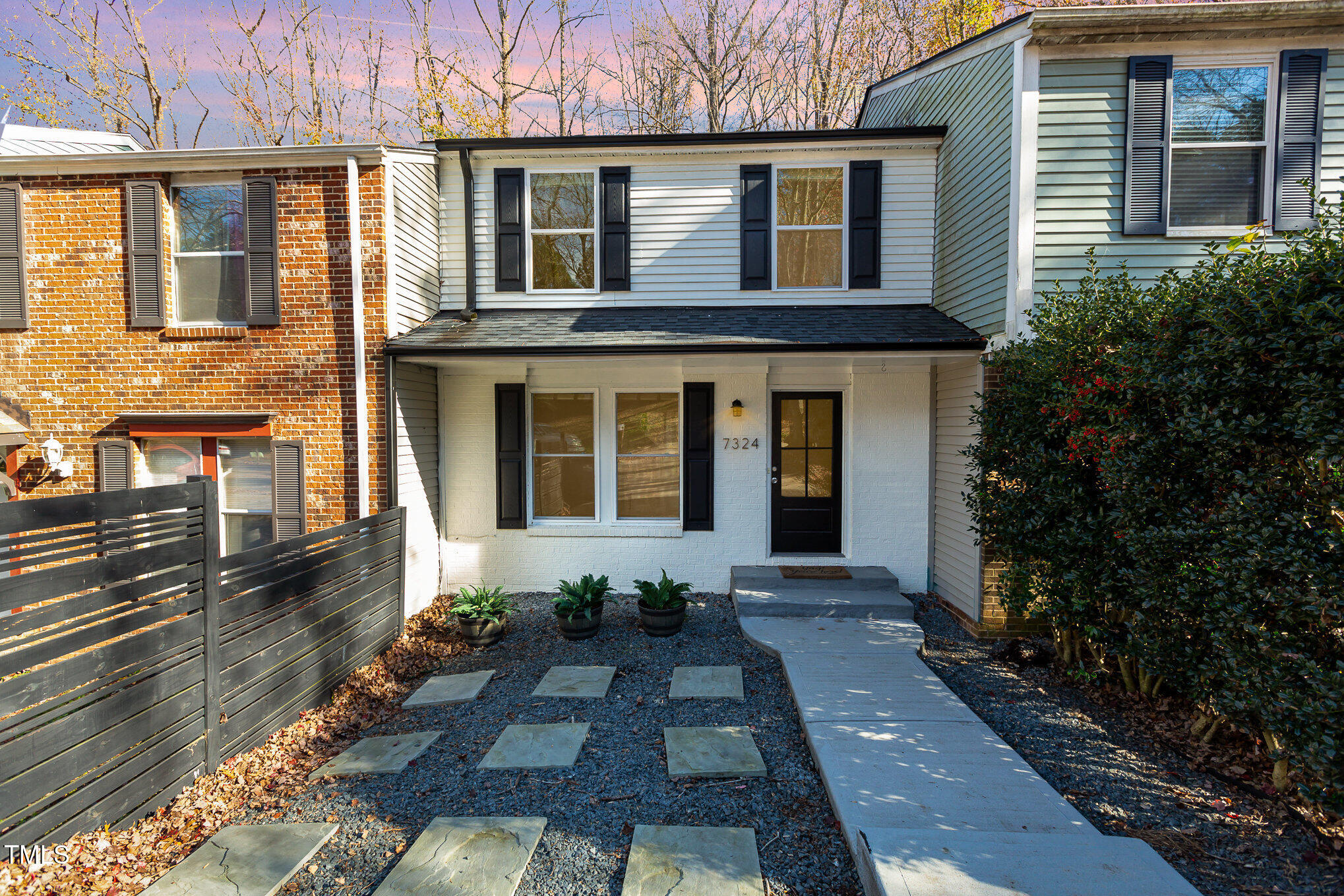 7324 Summerland Drive Raleigh, NC 27612 - Photo 1 of 24 a front view of a house with a yard