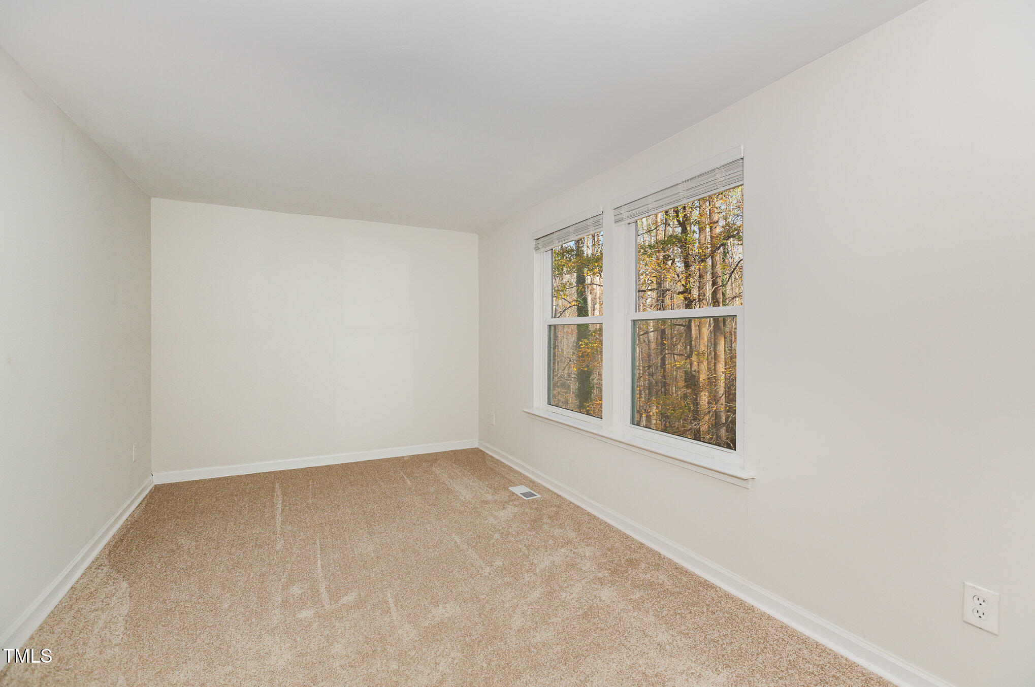 7324 Summerland Drive Raleigh, NC 27612 - Photo 14 of 24 an empty room with a window