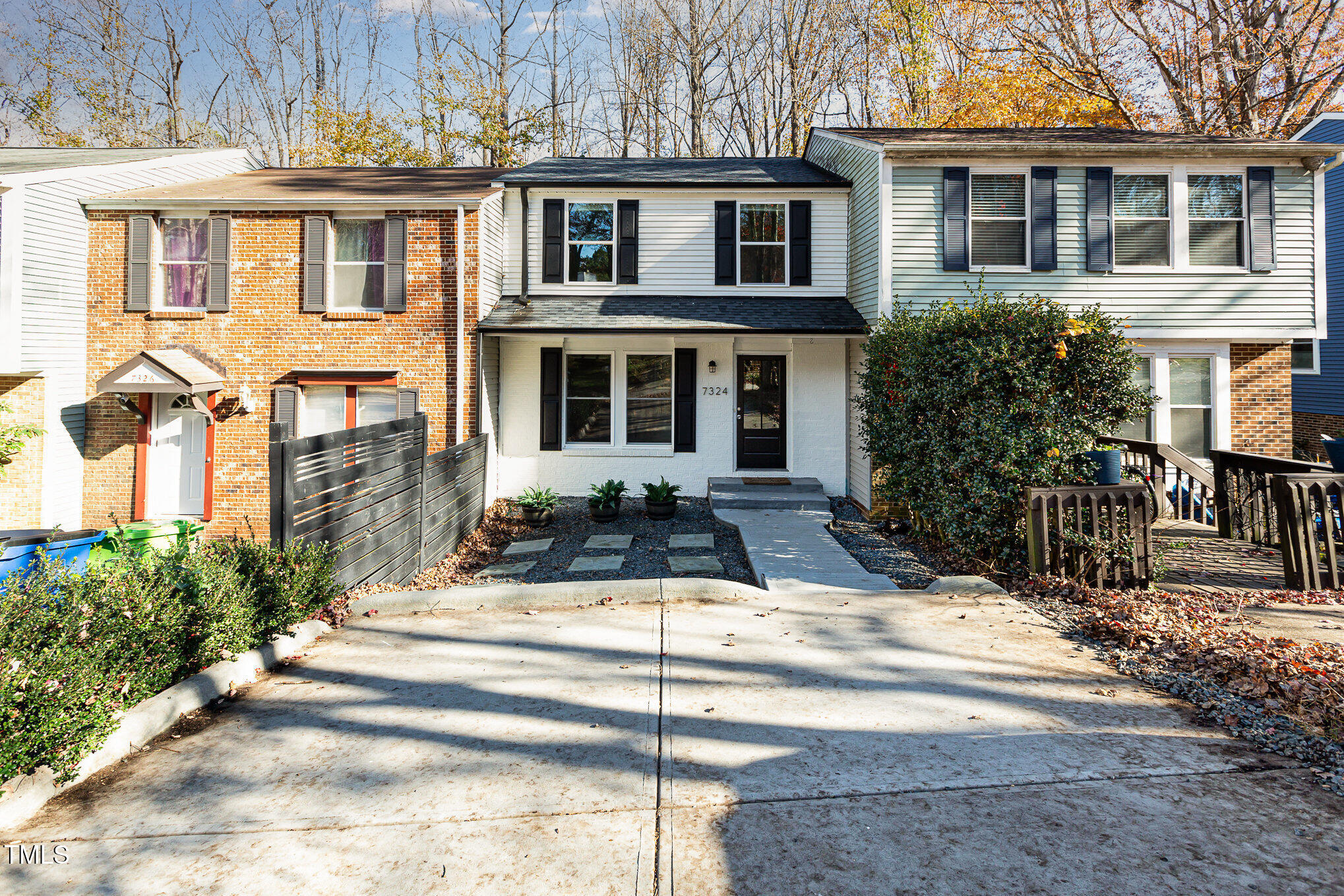 7324 Summerland Drive Raleigh, NC 27612 - Photo 2 of 24 a view of a white building among the front of a house