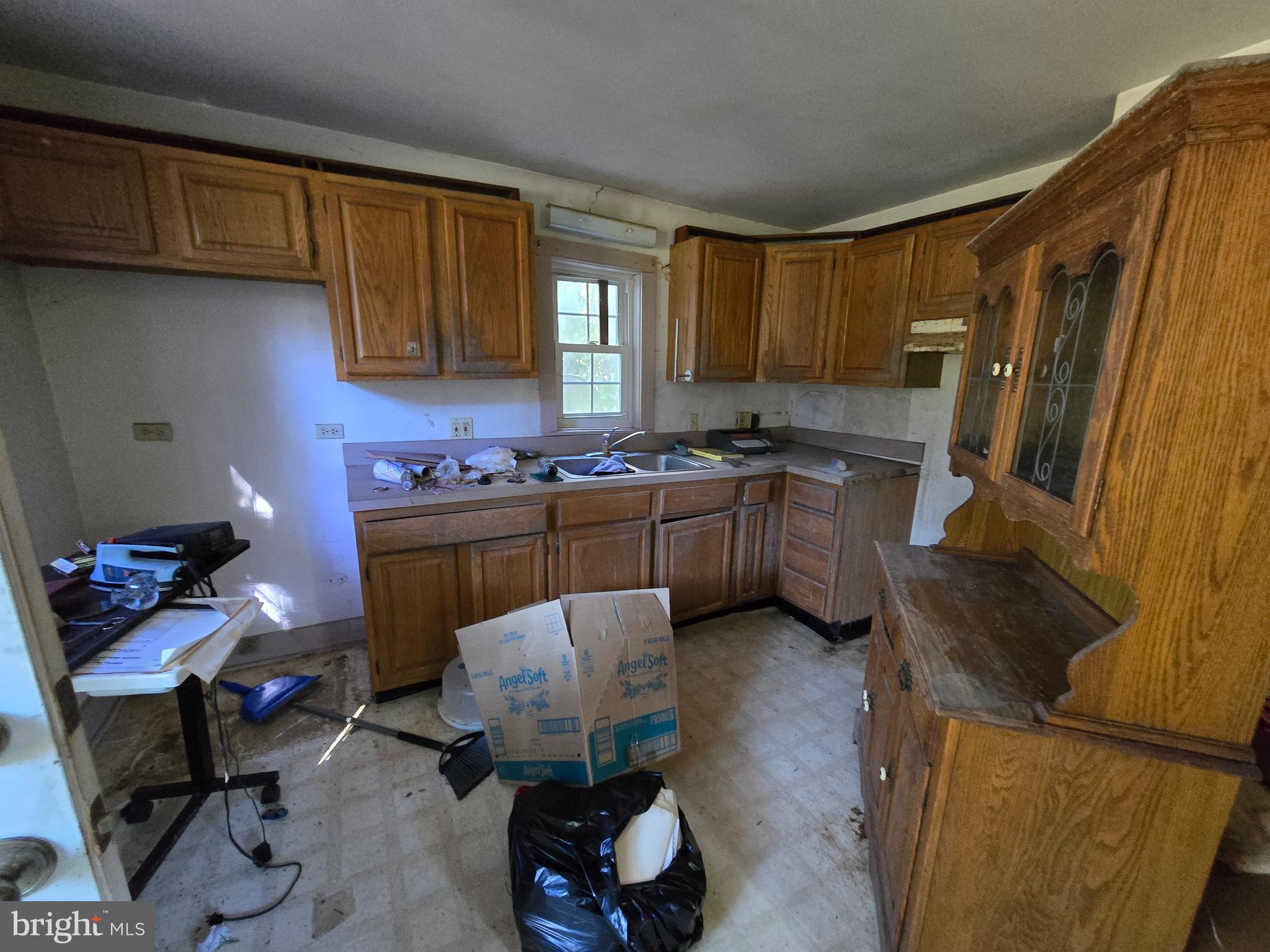26934 Old State Road Crisfield, MD 21817 - Photo 9 of 15 a kitchen with a sink cabinets and window