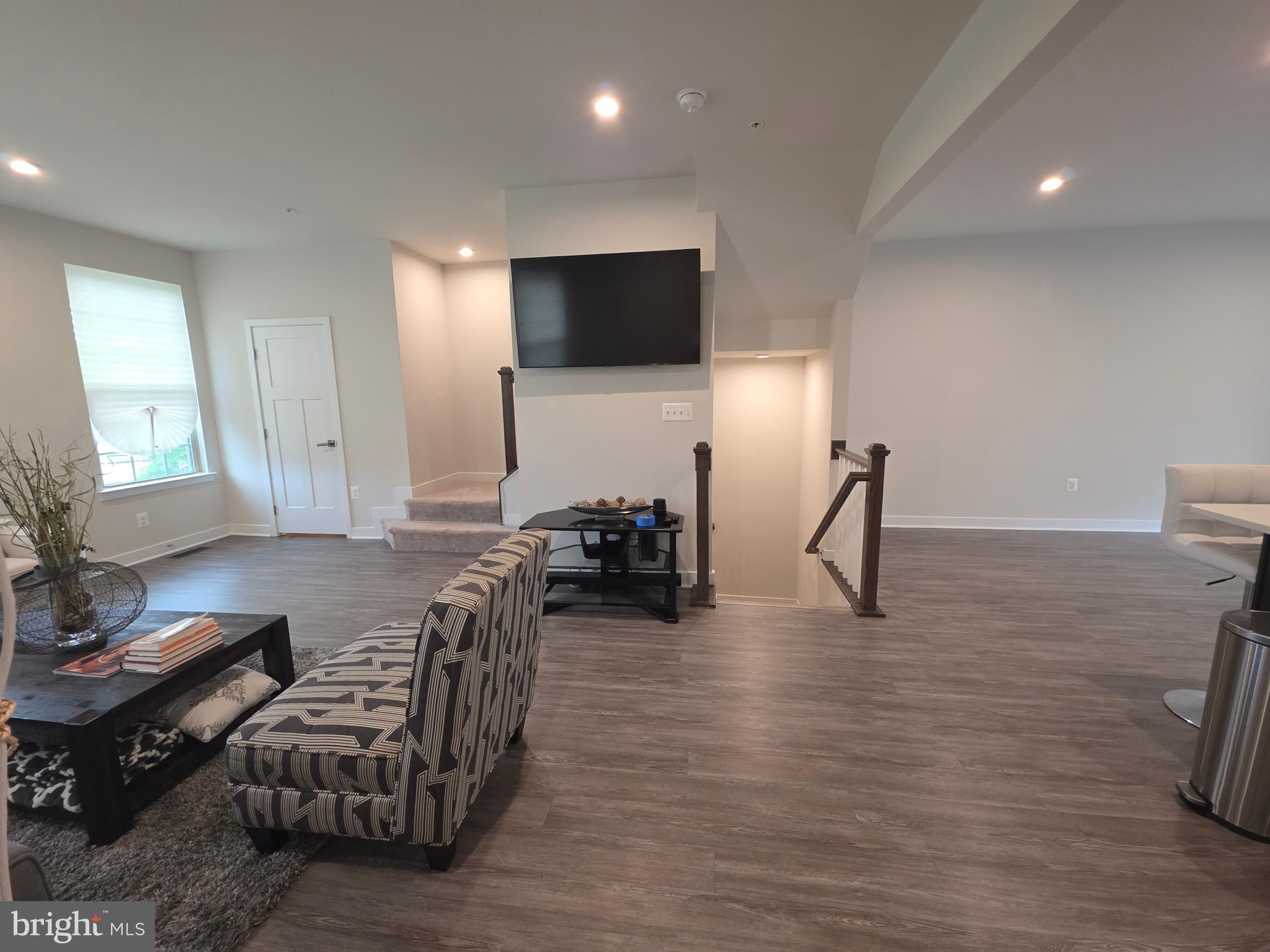 14510 Hunts Farm Road Brandywine, MD 20613 - Photo 14 of 74 a living room with furniture and a flat screen tv