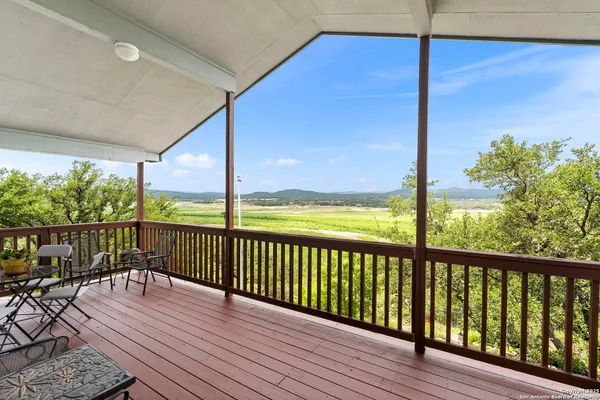 a view of balcony with wooden floor
