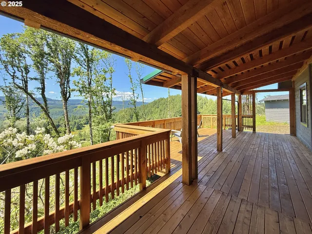 a view of balcony with wooden floor