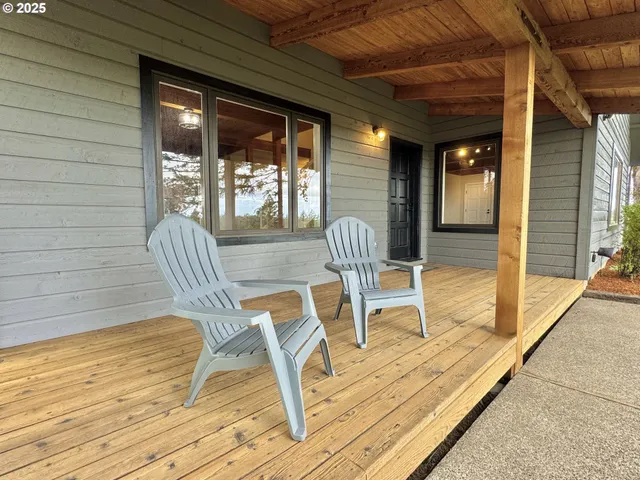 a view of a two chairs in the balcony