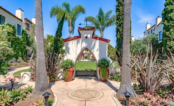 a view of a house with a yard and a patio