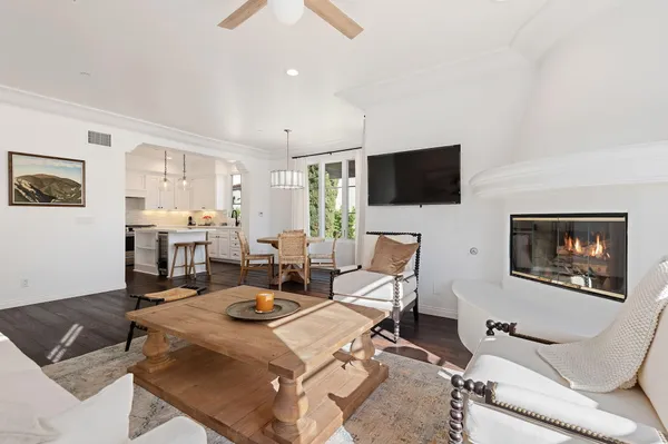 a living room with fireplace furniture and a flat screen tv