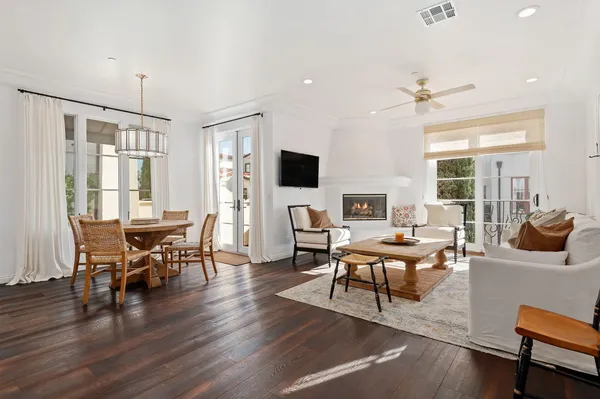 a view of a balcony dining table and chairs